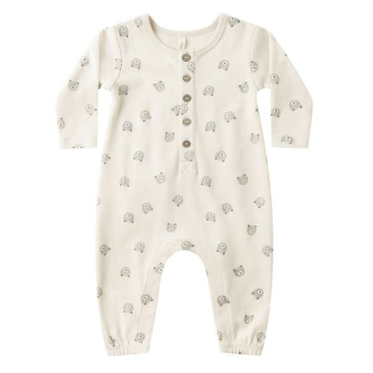 The Quincy Mae Baby Long Sleeve Jumpsuit features a cream color, small bear face prints, and a button-up front with coconut buttons.
