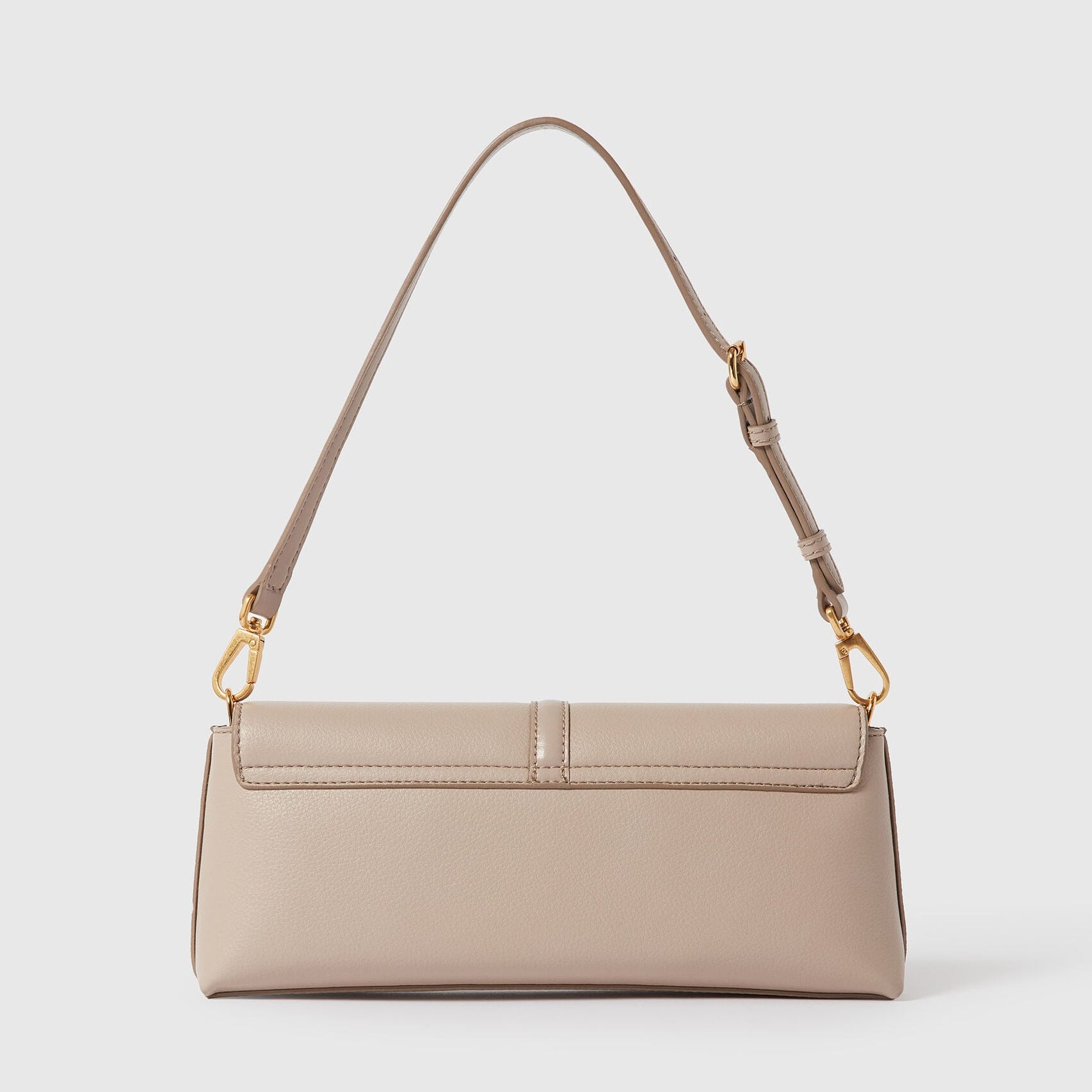 The Stella McCartney Ryder Pouchette Shoulder Bag is a small, rectangular beige luxury vegan bag, featuring a top handle, gold-tone hardware, and a fold-over flap, displayed against a plain white background.