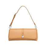 The Stella McCartney Ryder Pouchette Shoulder Bag is a tan vegan bag featuring a top handle, silver hardware, and a front clasp closure, shown on a white background.