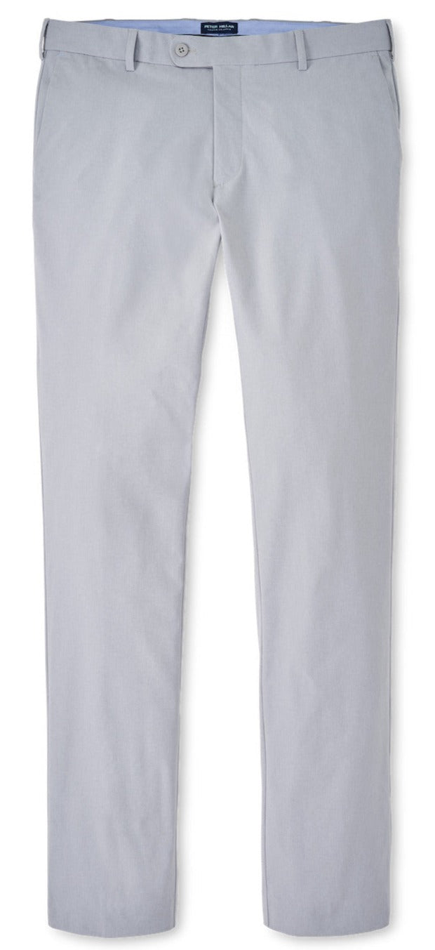 A pair of Peter Millar Surge Performance Trouser chinos with a button on the side, made with performance fabric.