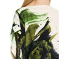 A person with long hair wears a Jason Wu Collection Asymmetrical Printed Crepe Boatneck Top with an abstract green and black brushstroke design.