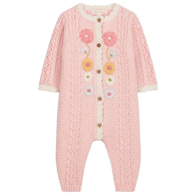 Introducing the Louise Misha Baby Girls’ Drilia Overalls: a pink knitted romper adorned with handmade floral embroidery, cable patterns, and wooden buttons. This charming jumpsuit features delicate white ruffle trim on the chest and cuffs, along with scalloped finishes for an extra-sweet touch.