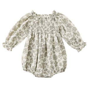 The Quincy Mae Baby Girl's Eden Romper features long sleeves, a ruffled neckline and cuffs, a gray floral print on white, and a beautifully smocked bodice for charming style.