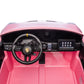 The dashboard of the Freddo 24V Porsche 911 GT3 Pink 2 Seater Ride-On features a steering wheel, dashboard controls, gear shifter, and pedals, shown from the driver’s perspective against a white background.