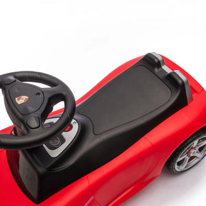 Freddo Porsche 911 Carrera GT Foot-to-Floor Ride-On in red, featuring a black seat, steering wheel, and dashboard—viewed from above on a white background—a stylish luxury car designed for kids to enjoy as a ride-on toy.