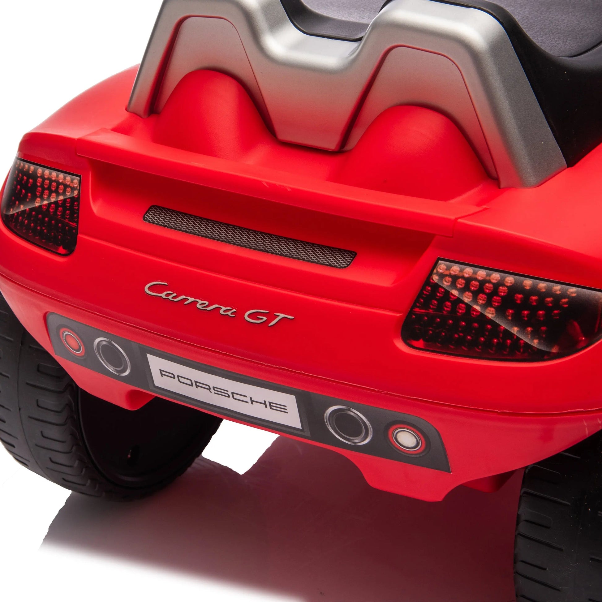 Close-up of the rear end of a red Freddo Porsche 911 Carrera GT Foot-to-Floor Ride-On, showcasing detailed taillights, authentic branding, and a realistic rear bumper design—ideal for young luxury car enthusiasts or anyone looking for inspiration for their next Porsche ride-on.