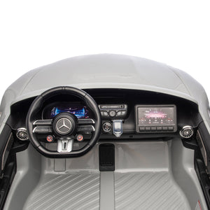 Top-down view of a modern Mercedes-Benz dashboard, featuring the steering wheel, digital displays, air vents, and control buttons with a sleek, minimalist interior design—just like in the impressive 24V Mercedes AMG GT63 Gray 2 Seater Ride-On by Freddo.