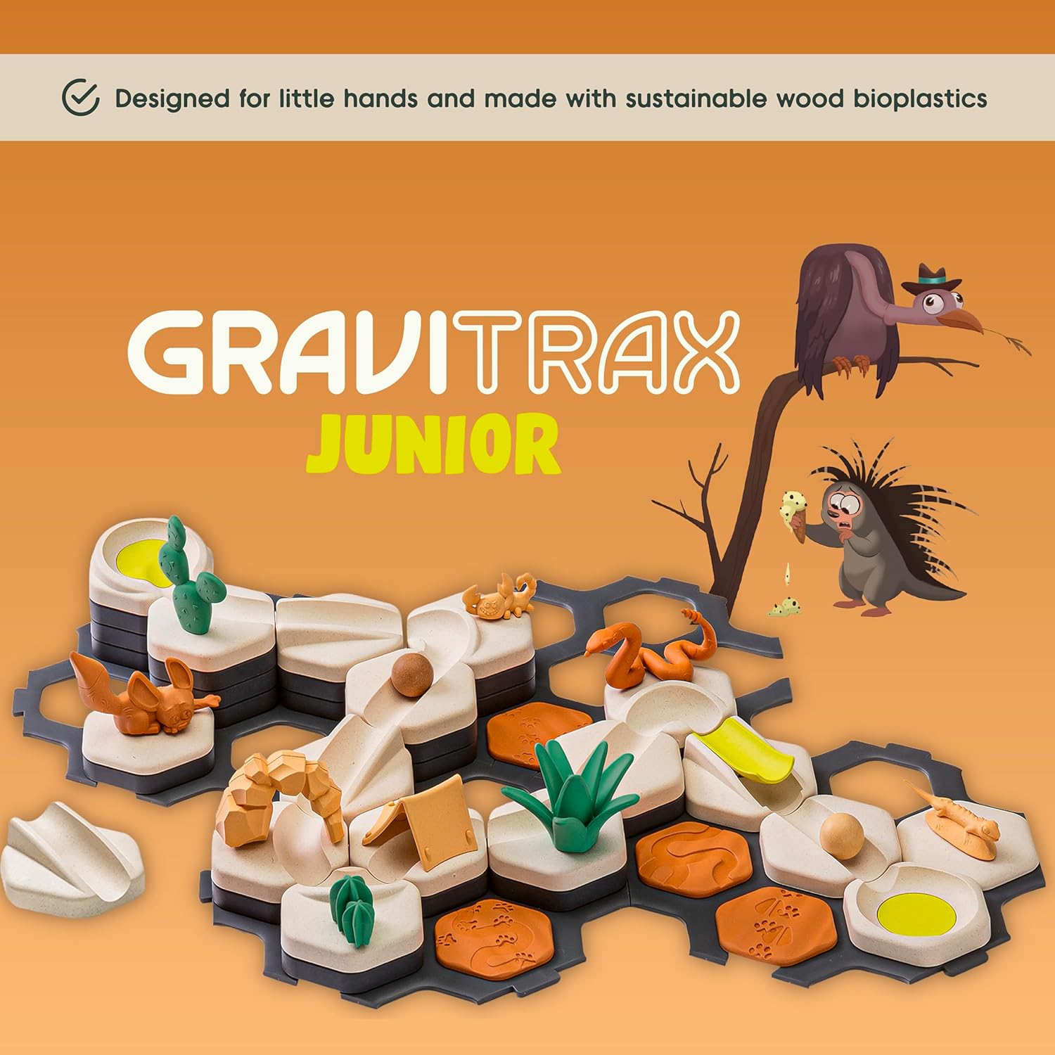 The GraviTrax Junior: Desert Starter Set by GraviTrax features animal figures, wooden bioplastic tiles, and a nature-themed design on a hexagonal black base. This STEM toy uses eco-friendly, child-safe materials for creative marble-powered play.