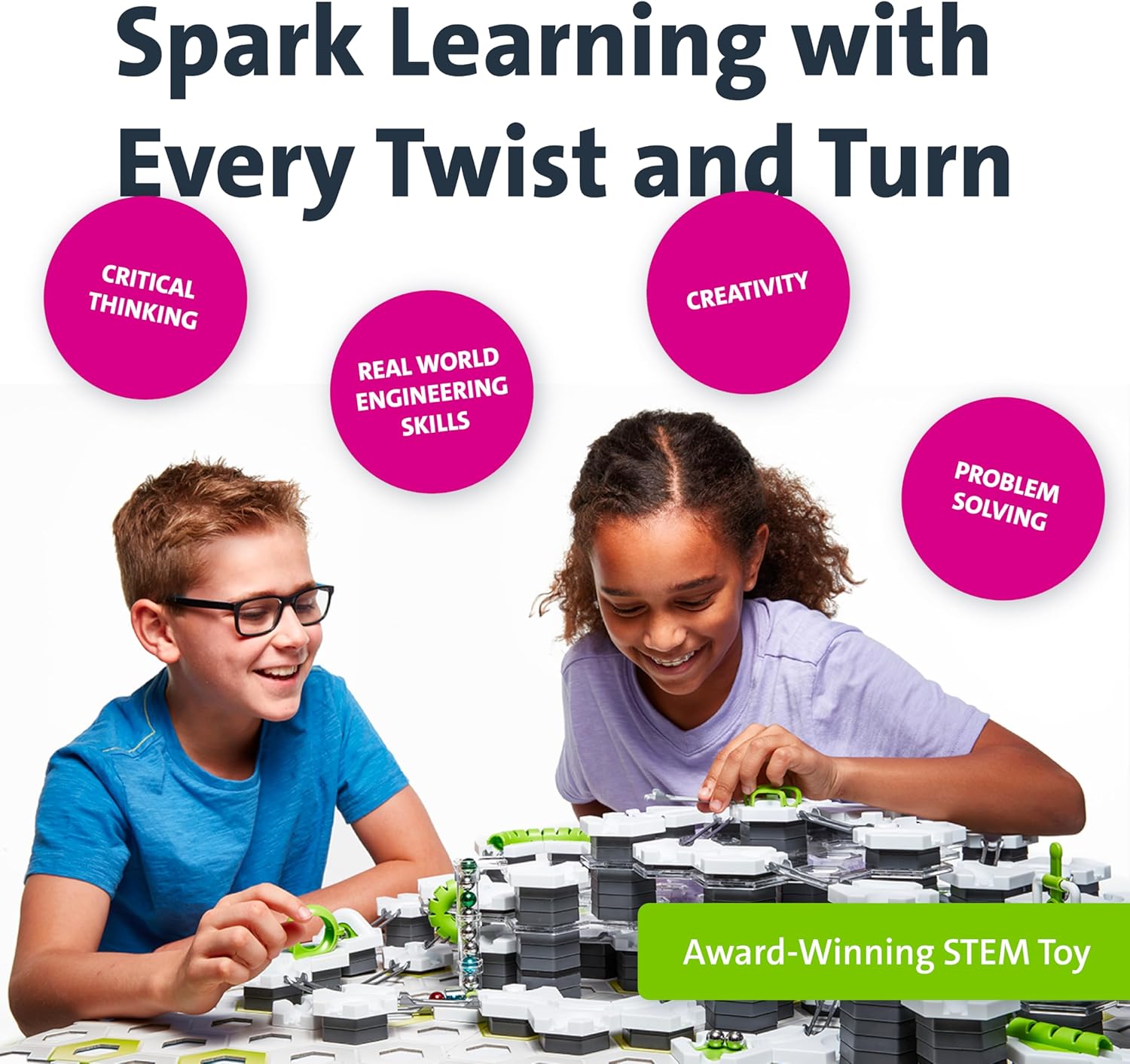 Two kids play with the GraviTrax: Starter Set, a STEM toy from GraviTrax. Its interlocking pieces boost critical thinking, creativity, and problem-solving skills—perfect fun for young builders.
