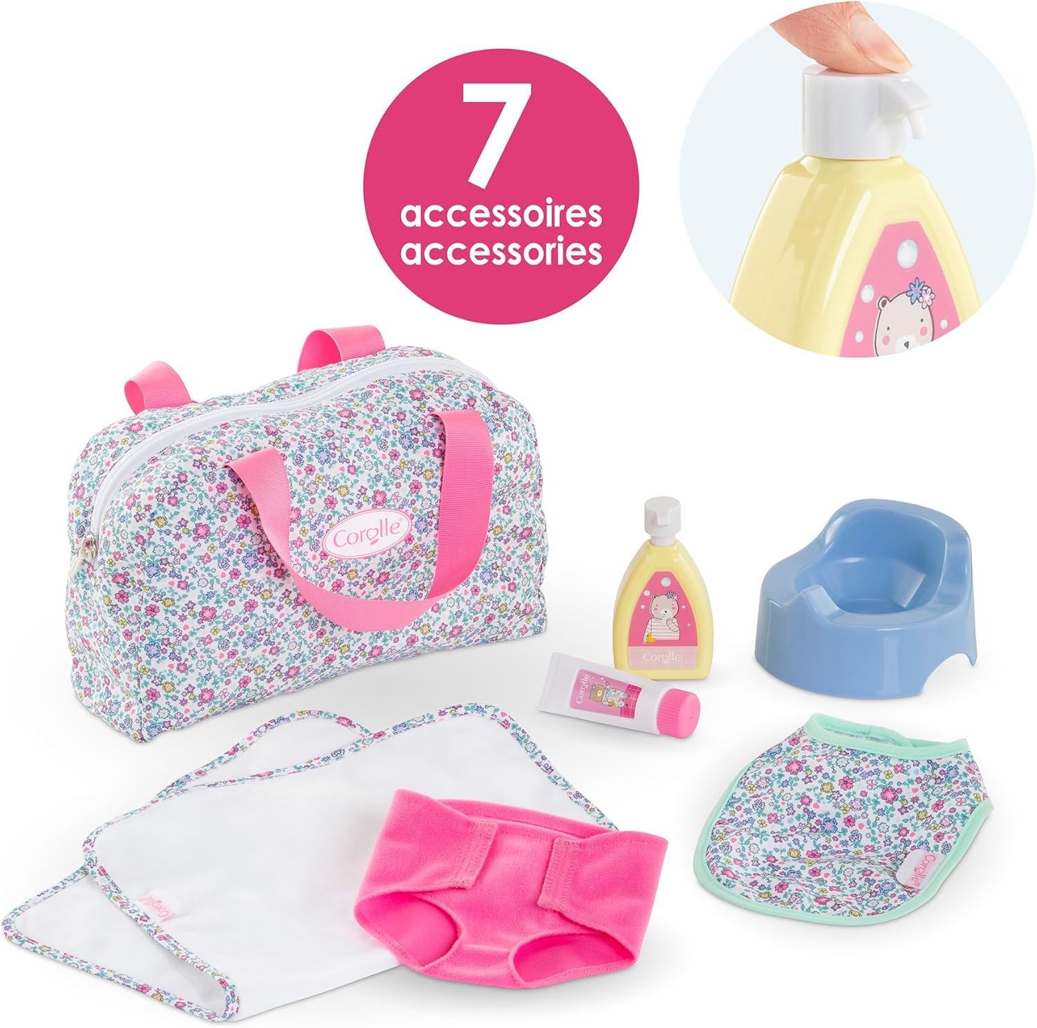 The Corolle Floral Changing Accessories Set includes 7 doll accessories: a floral bag with pink handles, blue potty, bottle, pump tube, bib, diaper, and cloth. A close-up shows a hand pressing the pump bottle.