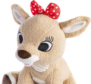 The Kids Preferred Clarice Plush features large embroidered eyes, long lashes, a red and white polka dot bow, and soft light brown fur—a charming nod to the Christmas classic "Rudolph.