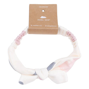 The Angel Dear Modal Rib Knot Headband features pink, white, and gray accents with a knotted bow, attached to a brown tag. This soft, stylish accessory is perfect for any fall wardrobe.