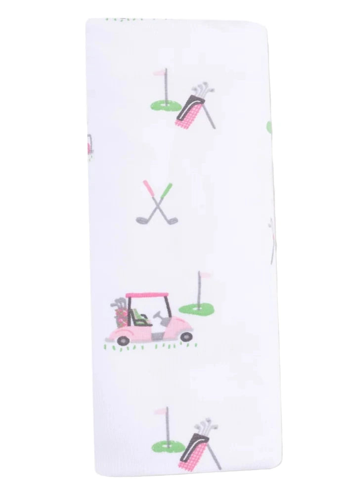 The Angel Dear Baby Golf Carts Ruffle Burp Cloth features a white bamboo fabric adorned with cute images of golf carts, crossed clubs, golf bags, and flags on greens.