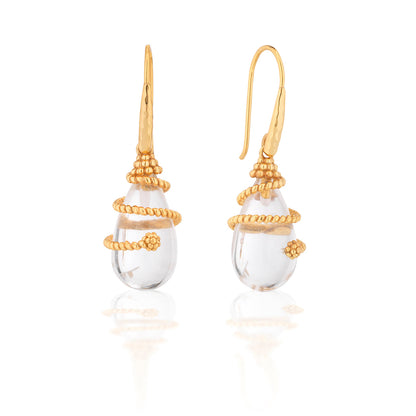 The Lily Drop Earrings by Juliska Capucine De Wulf feature clear teardrop stones wrapped in textured gold thread, shown against a white background.