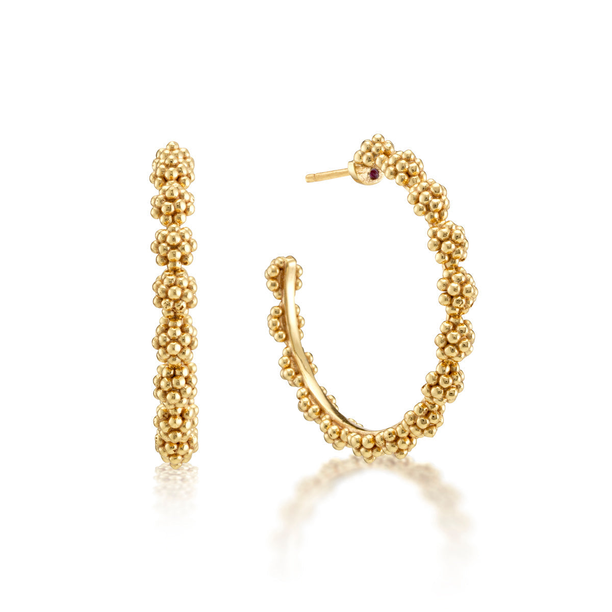 The Berry Icon Medium Hoop Earrings by Juliska Capucine De Wulf feature a golden, berries-inspired beaded texture and are shown from front and side views against a white background.