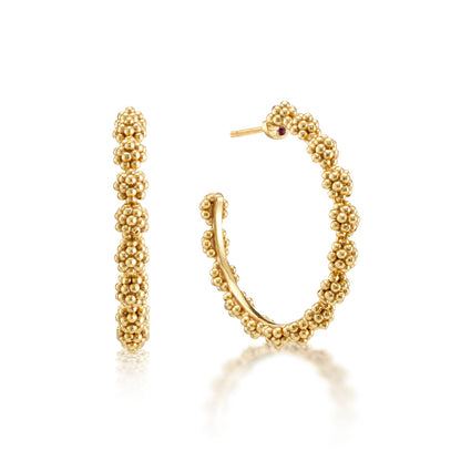 The Berry Icon Medium Hoop Earrings by Juliska Capucine De Wulf feature a golden, berries-inspired beaded texture and are shown from front and side views against a white background.