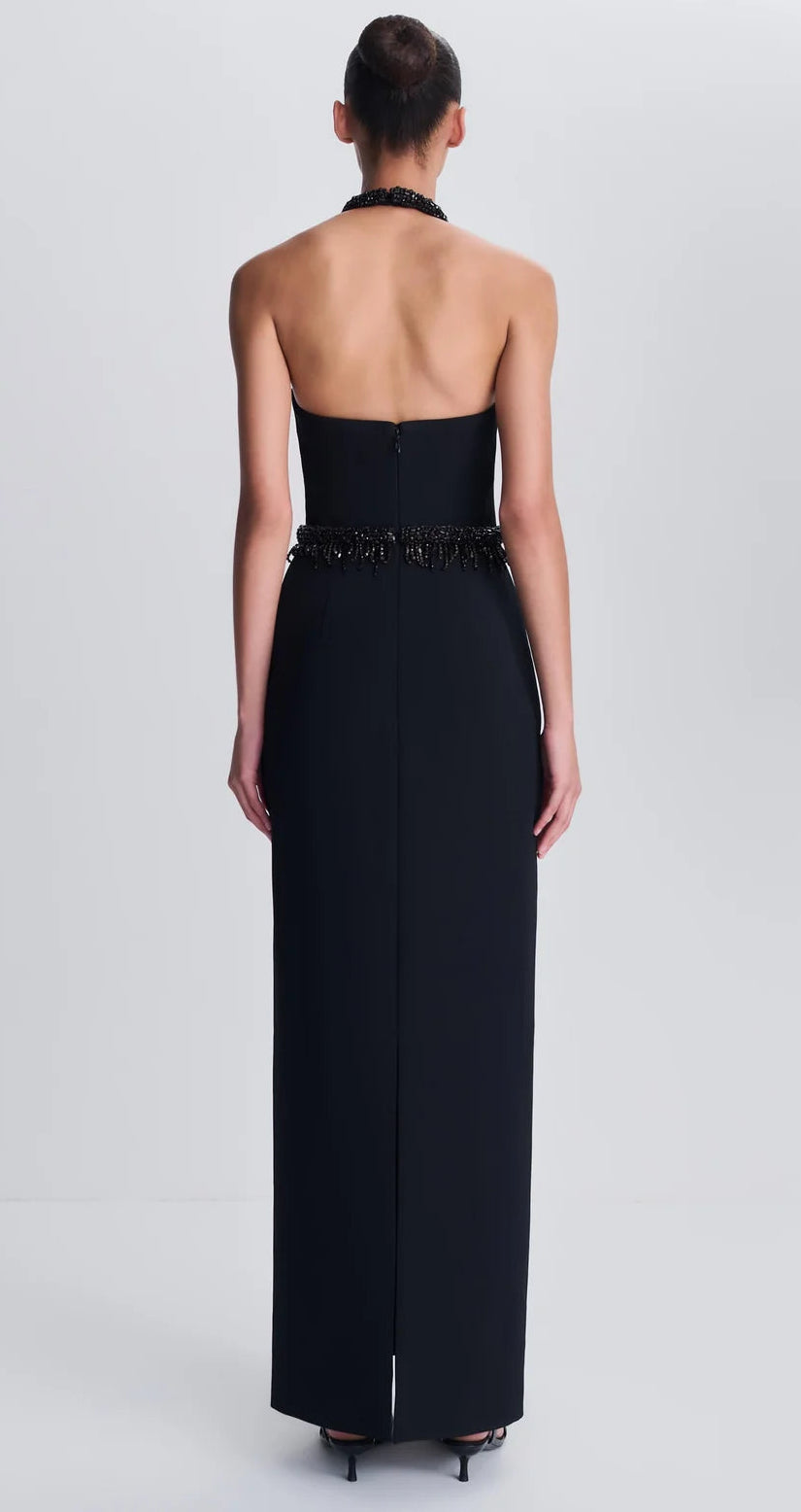 Back view of the black Simkhai Zoriel Gown featuring beaded trim at the strapless neckline and waist.