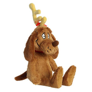 The Dr. Seuss Max 20" plush toy by Aurora, a brown dog adorned with a red collar, yellow antler headband, and a red ribbon tied to the antlers, perfectly captures the whimsy of Mr. Grinch’s Christmas canine companion.