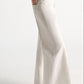 Side view of off-white, wide-leg Dorothee Schumacher Denim Attraction Pant styled with a dark belt.