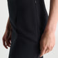 A close-up side view of a person wearing the Dorothee Schumacher Emotional Essence Skirt—a black pencil skirt with a side zipper, crafted from smooth Punto Milano fabric, and styled as an elegant work week essential.