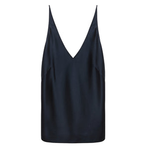 The Sense of Shine Tank by Dorothee Schumacher is a black stretch silk-satin camisole with adjustable spaghetti straps and a deep V-neckline, shown against a white background.