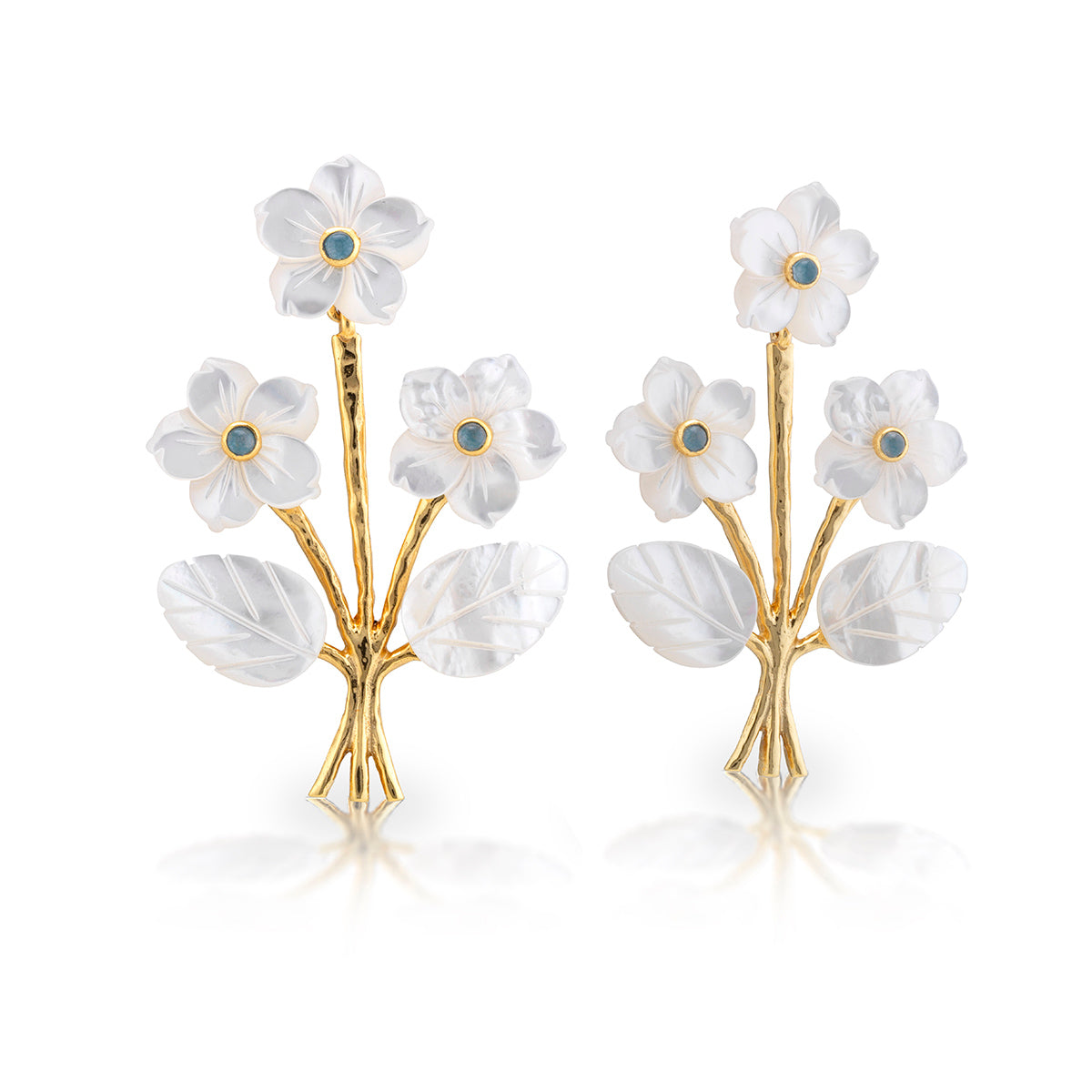 Mermaid Garden Convertible Bouquet Post Earrings by Juliska Capucine De Wulf feature gold floral studs with white carved petals, blue centers, and leaf details—an elegant choice for bouquet earring lovers.