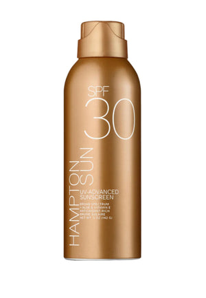 A gold bottle of Hampton Sun SPF 30 UV Advanced Mist provides broad-spectrum protection, with the product name and details clearly shown on the front label.