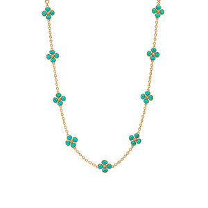 The Berry Clover Double Sided Necklace by Juliska Capucine De Wulf features a double-sided chain adorned with clusters of small turquoise stones in delicate four-petal flower shapes.