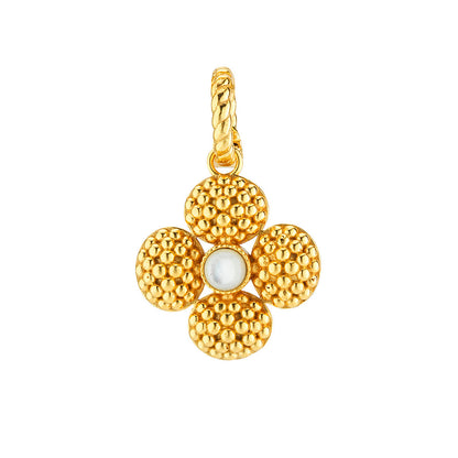 The Juliska Capucine De Wulf Berry Clover Double Sided Pendant features a gold flower design with textured petals, a smooth white center, and a twisted loop for easy attachment—crafted as a lucky charm.