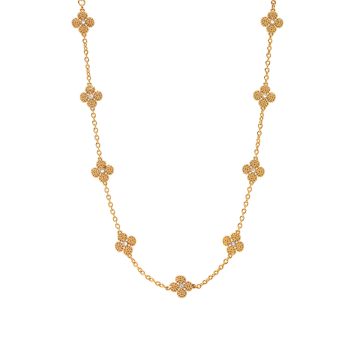 The Berry Clover Double Sided Necklace by Juliska Capucine De Wulf features a station chain with evenly spaced, double-sided four-leaf clover motifs along its length.
