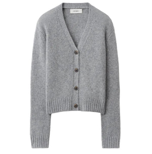 Lisa Yang Marionette Cardigan in gray, featuring a V-neckline, long sleeves, and ribbed cuffs and hem, displayed on a white background.
