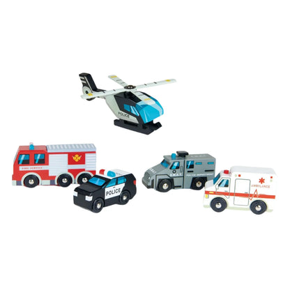 The Tender Leaf Toys "Tender Leaf Emergency Vehicles" set is ideal for children aged 3 and up, featuring a collection of solid wood toy vehicles on a white background. This set includes a helicopter with rotating blades, a fire truck, a police car, a SWAT truck, and an ambulance.