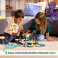 Two children play on the floor with the GraviTrax Junior: Ocean Starter Set by GraviTrax. Illustrations of a cartoon octopus and stingray appear, along with the text: "Build stronger bonds through play!.