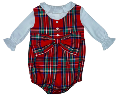 The Brown Bowen & Co. Lolli Bow Back Bubble in Tybee Tartan by Brown Bowen & Company is a festive red plaid baby romper with a classic silhouette, featuring a large bow on the front, white long sleeves, and a white collar.