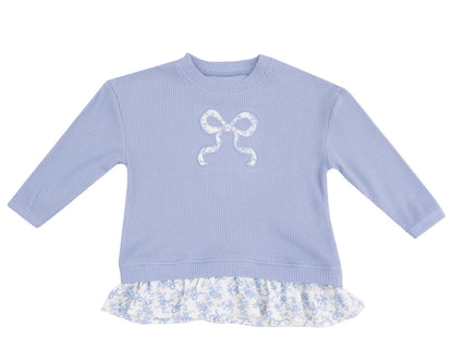 The Angel Dear Baby Girls' Waffle Ruffle Pull Over features a white bow applique and floral ruffle hem, offering comfort and style—perfect to pair with the matching rib leggings for an adorable, coordinated look.