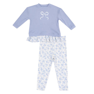 The Angel Dear Baby Girls' Waffle Ruffle Pull Over & Rib Bow Applique with Rib Leggings set features a comfy lavender top with bow and ruffled hem, paired with white ribbed leggings accented by a lavender floral design.