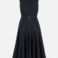 Elevate your wardrobe with the Monique Denim Dress by Emilia Wickstead—a sleeveless black midi dress featuring a chic collared neckline, button placket, belted waist, and a flared skirt accented with striking white contrast stitching.