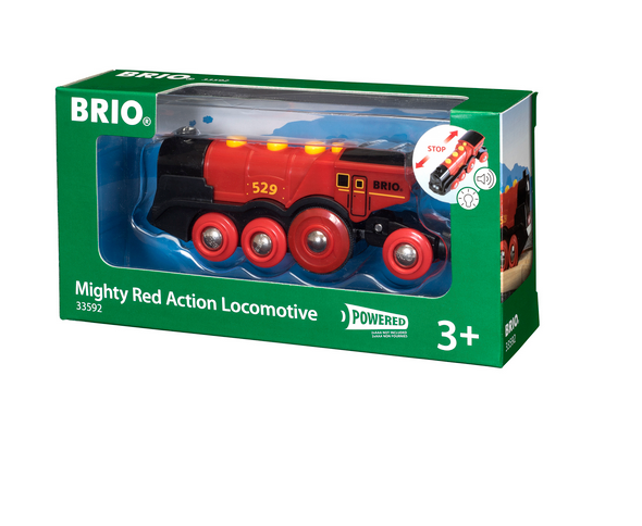 A boxed toy train labeled "BRIO World Mighty Red Action Locomotive" by Brio, suitable for ages 3 and up. The packaging highlights a striking red and black locomotive with the number 529 on its side, designed to help develop fine motor skills in young engineers.