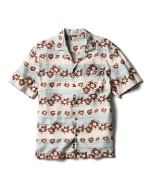 The Breeze Camp Shirt by Faherty is a short-sleeve button-up featuring light blue and white stripes, a brown floral pattern, and a chest pocket on the left side.