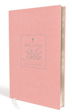 A pink Thomas Nelson book titled "Baby's First KJV New Testament" stands upright with a white ribbon bookmark hanging out, perfect for baby dedication.