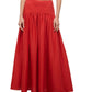 A person wearing the Staud Procida Linen Skirt in red—a high-waisted, ankle-length maxi with a gathered waistband—paired with black sandals. Their arms are relaxed by their sides.