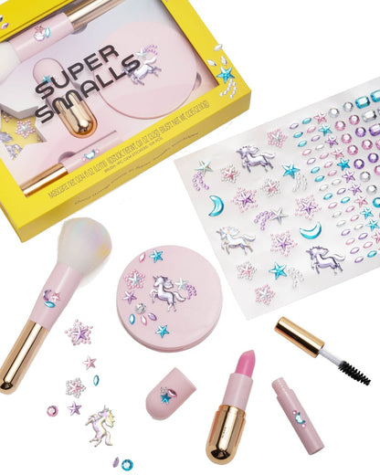 The Super Smalls Unicorn Makeup Kit is a pink kids set with a brush, compact, lipstick, mascara, unicorn stickers, and comes next to a yellow "Super Smalls" box—perfect for children who love imaginative unicorn makeup play.
