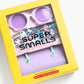 The Super Smalls Mermaid Splash & Sparkle Gemify Sunglasses & Case includes mermaid sunglasses with flower frames, a bejeweled case, and a lavender accessory—ideal for kids' crafts.