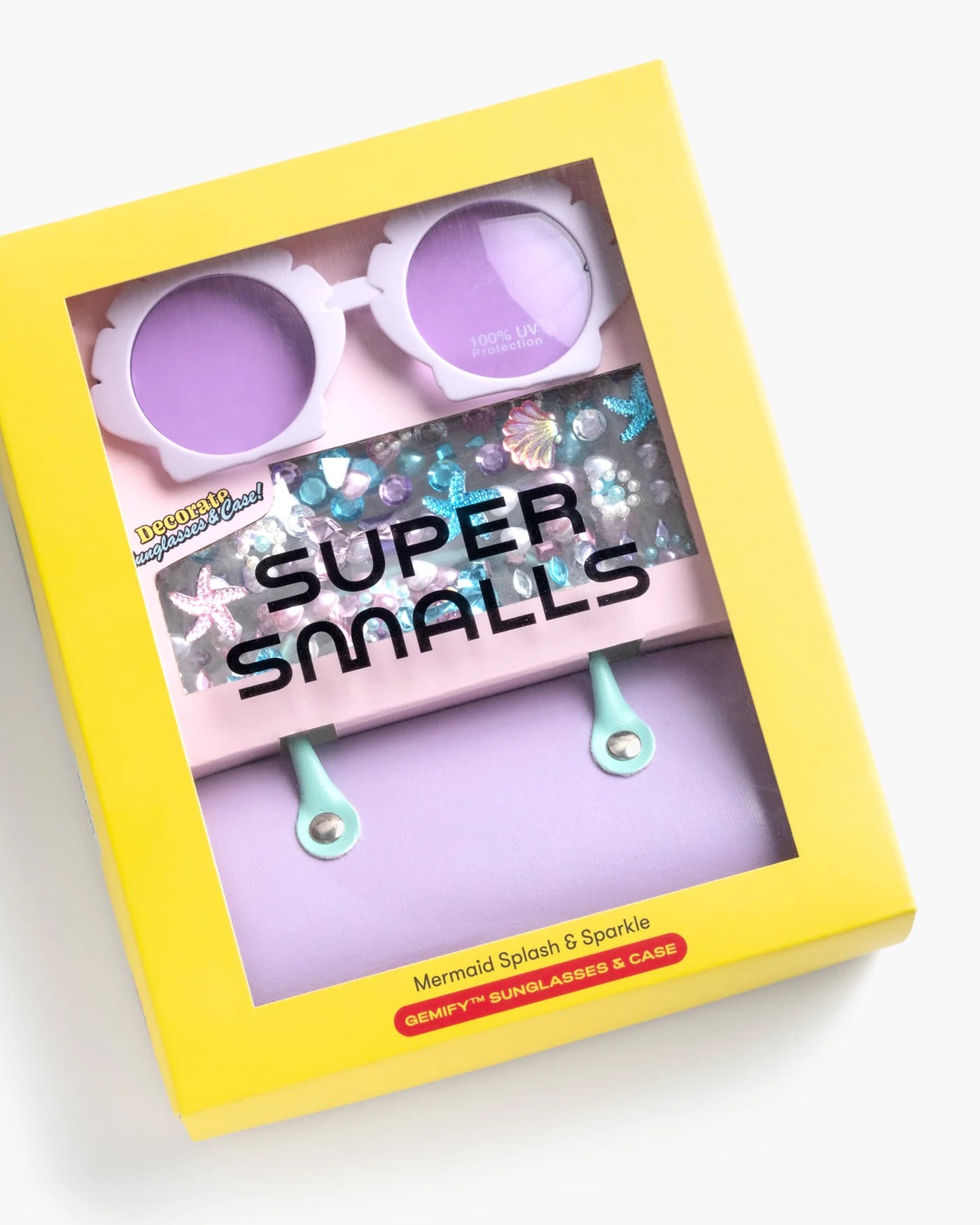 The Super Smalls Mermaid Splash & Sparkle Gemify Sunglasses & Case includes mermaid sunglasses with flower frames, a bejeweled case, and a lavender accessory—ideal for kids' crafts.