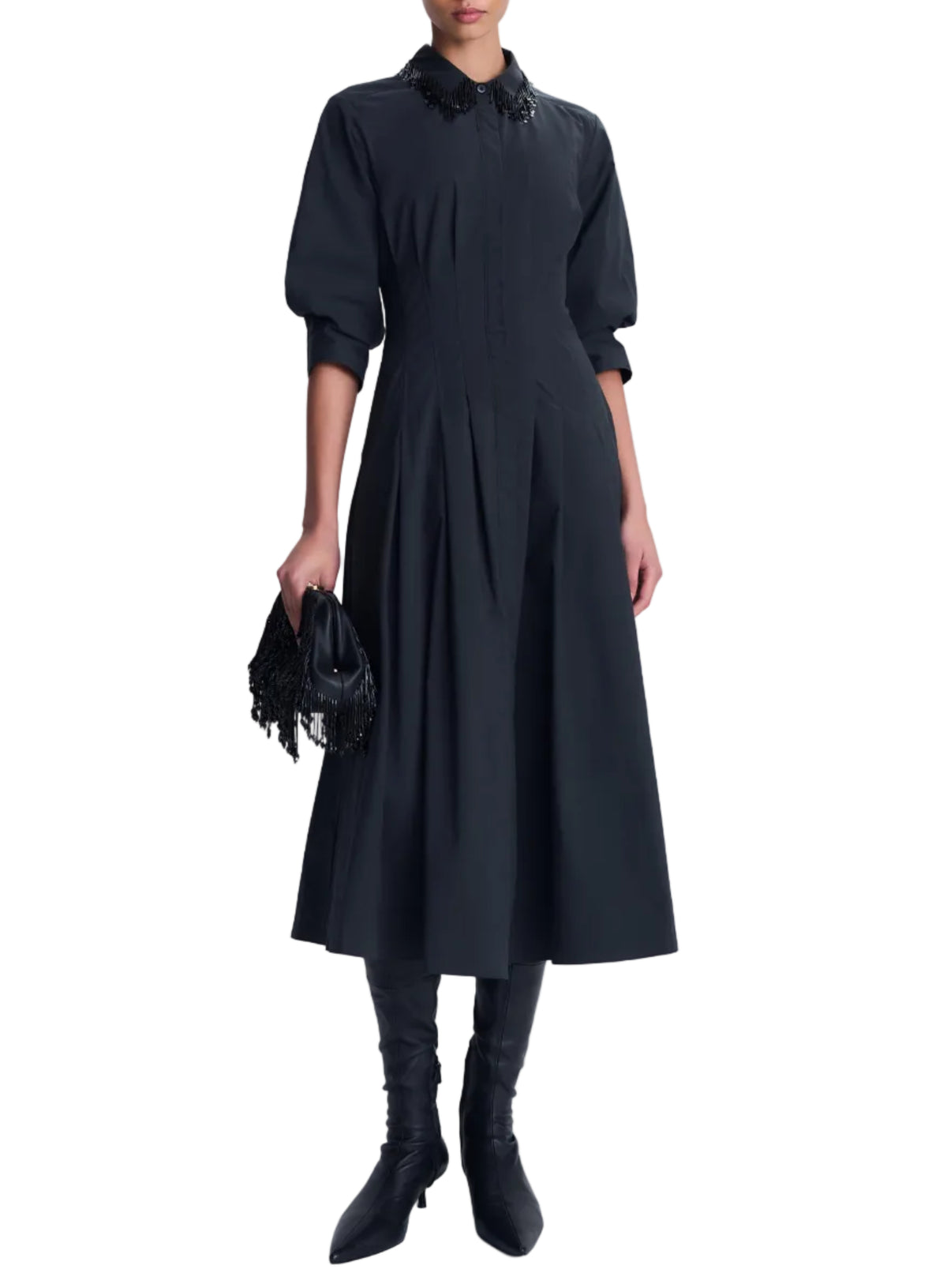 A black cotton poplin Jazz Embellished Collar Midi Dress by Simkhai with three-quarter sleeves, worn with black knee-high boots and a beaded fringe clutch.