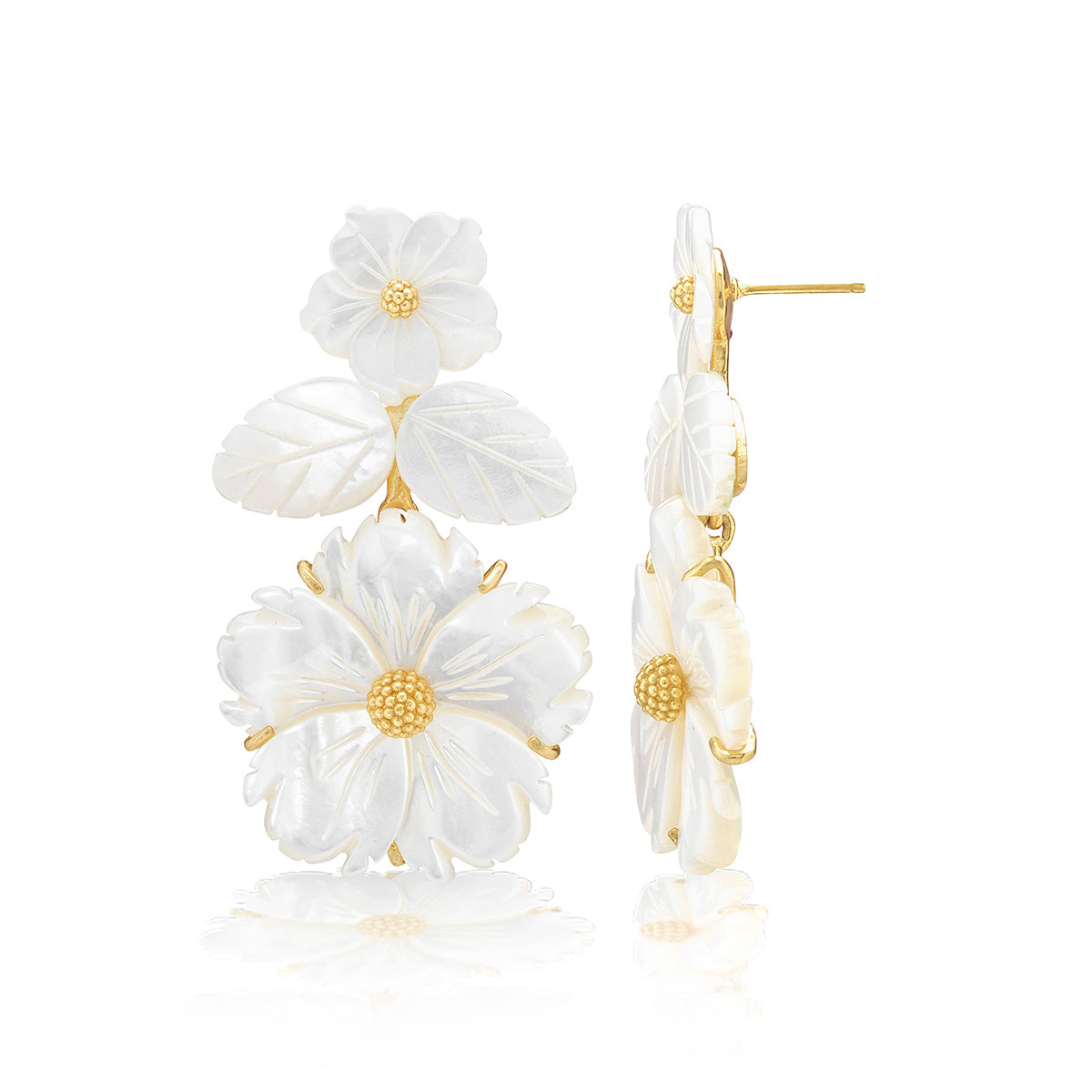 The Juliska Capucine De Wulf Mermaid Garden Convertible Floral Post Drop Earrings feature gold floral motifs with white, carved flower and leaf designs and textured gold centers, shown from both front and side views.