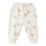 The Quincy Mae Baby Relaxed Sweatpant features an elastic waistband, drawstring, and a cute beige bear face pattern—offering your little one both comfort and adorable style.
