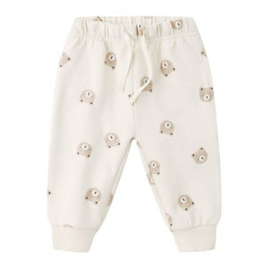 The Quincy Mae Baby Relaxed Sweatpant features an elastic waistband, drawstring, and a cute beige bear face pattern—offering your little one both comfort and adorable style.