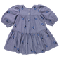 The Pink Chicken Girls' Fiona Dress features long sleeves, a gathered skirt, Blue Blossom Embroidery, and three front buttons in light blue.