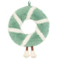A Jellycat Amuseables Pinecone Wreath with soft green and white segments, dangling brown legs with white boots, and a ribbon loop for hanging.